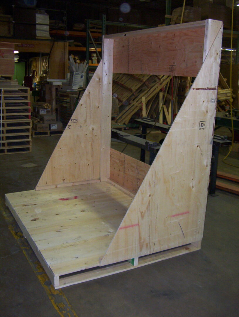 A wooden pallet with a large triangle shaped structure.