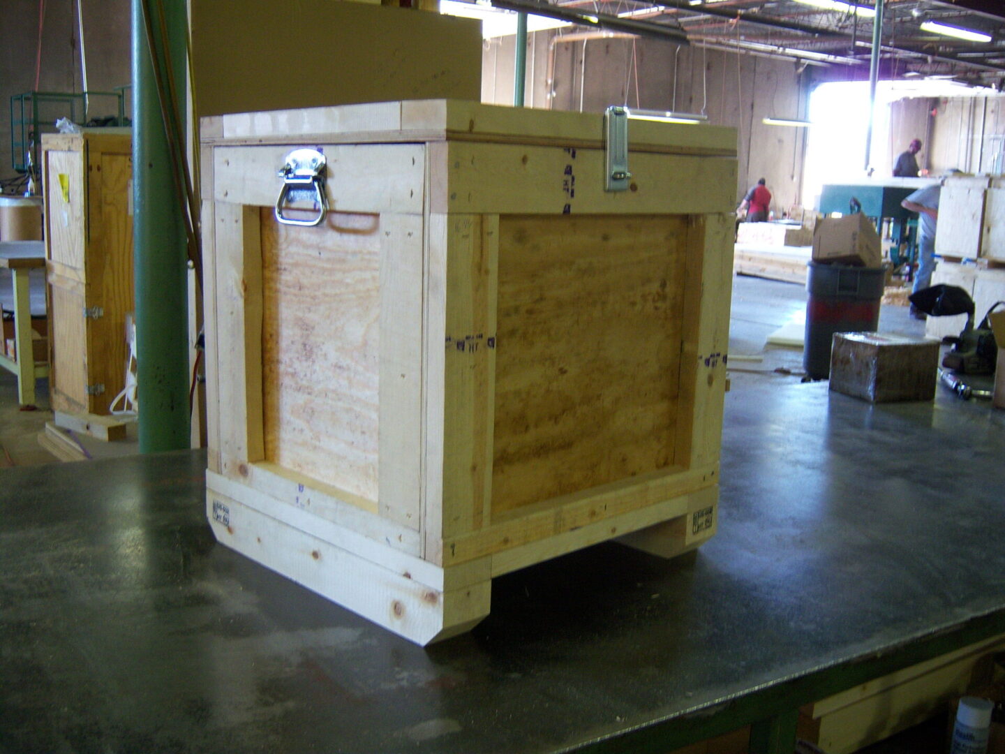 A wooden crate sitting on top of a floor.