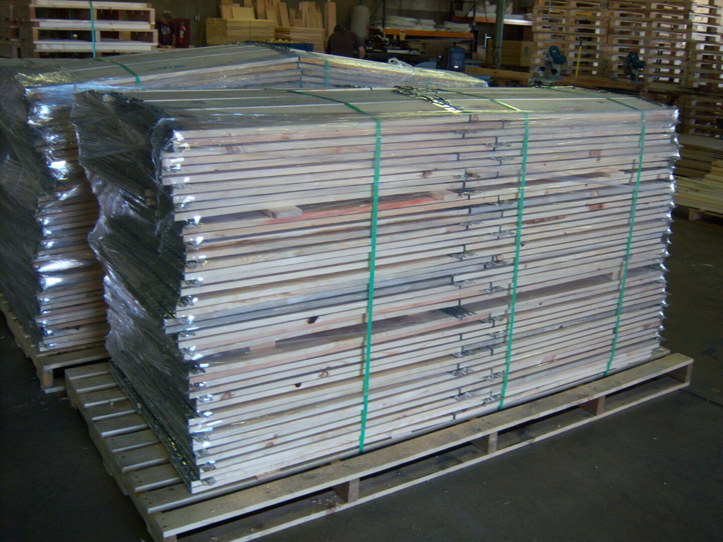A pallet of wooden planks stacked on top of each other.