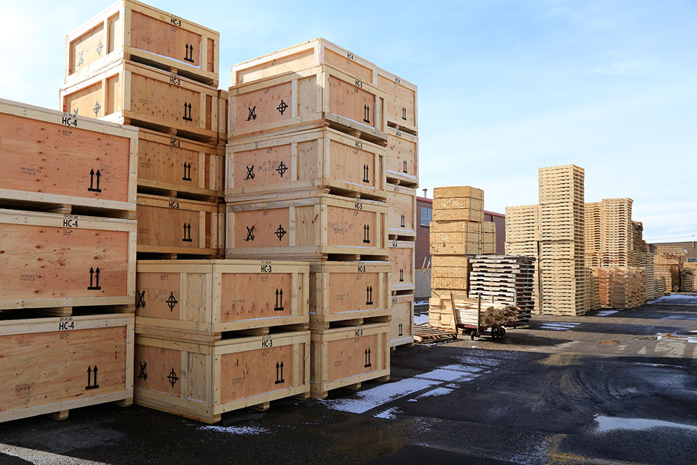 A large pile of wooden crates stacked on top of each other.